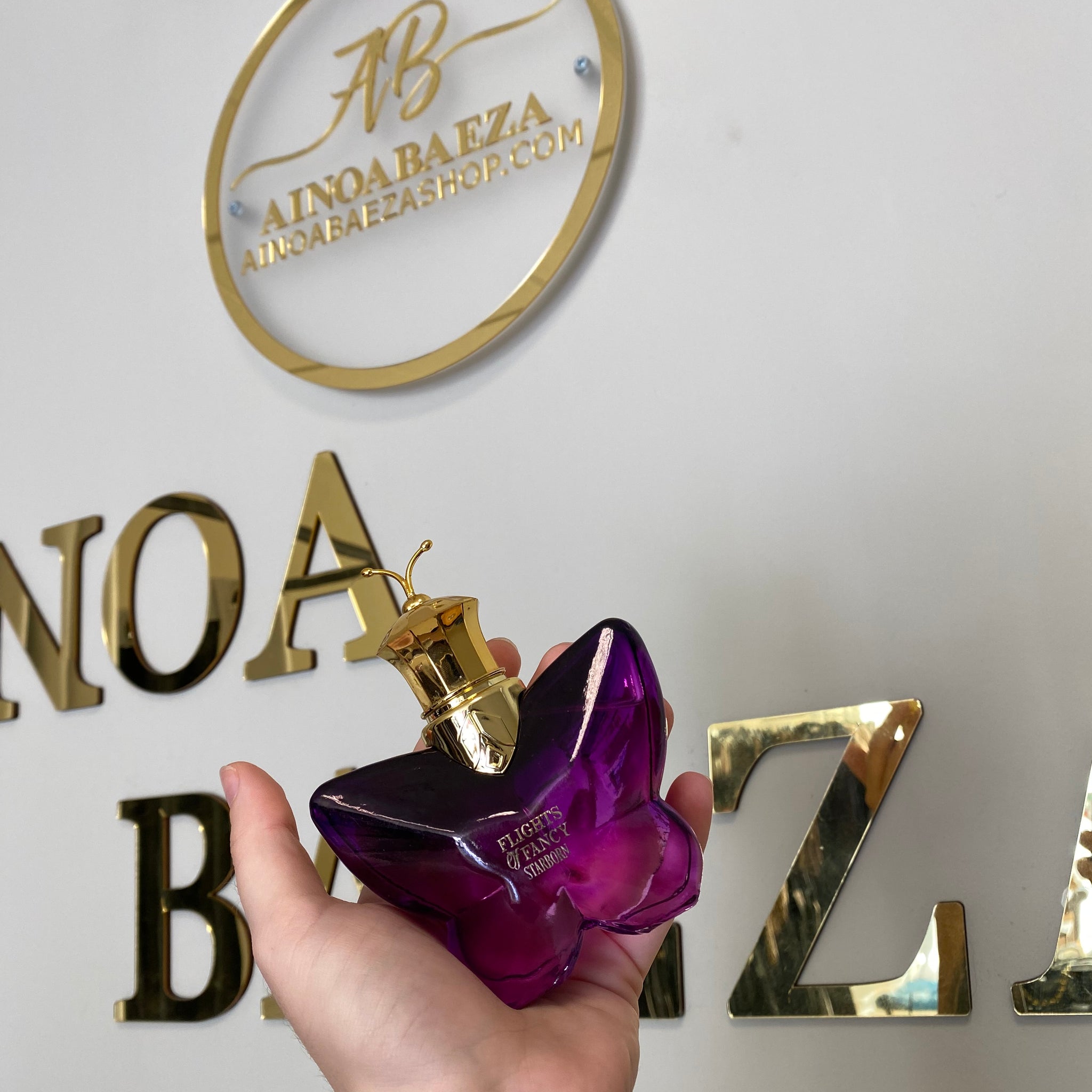 Perfume mariposa morada